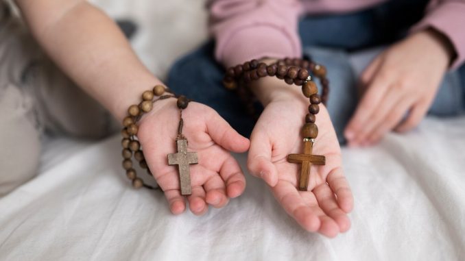 high-angle-hands-holding-rosaries_small